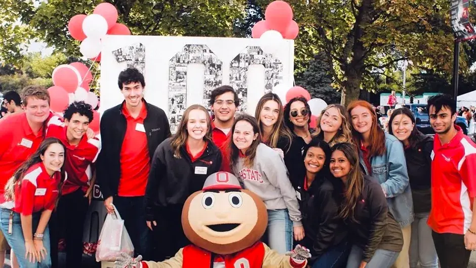 group of student alumni council pose for a picture with Brutus buckeye