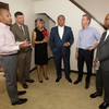 Leaders in the Partners Achieving Community Transformation organization tour the Poindexter Community on June 30, 2014 with Shaun Donovan, secretary of the U.S. Department of Housing and Urban Development, second from right.