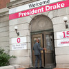 President Michael V. Drake walks into Bricker Hall on his first day of work on June 30, 2014.
