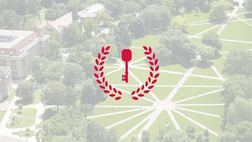 A red key overlays a picture of the Oval pathways on campus