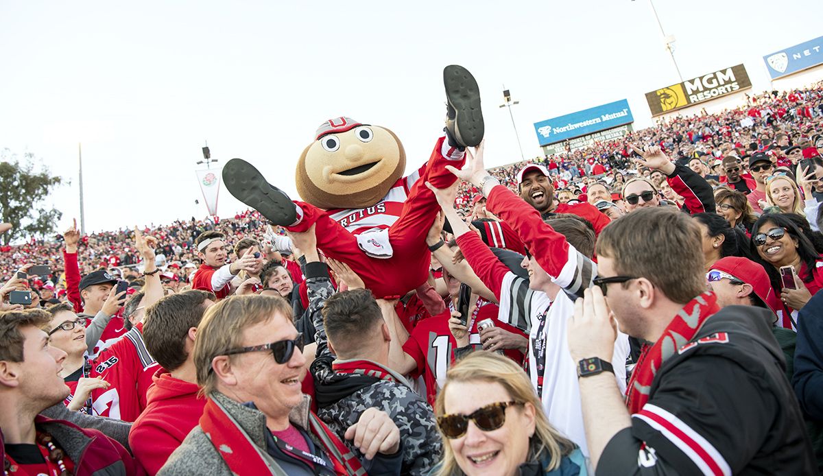 Brutus Buckeye held aloft by Ohio State football fans during a football game at Ohio Stadium.