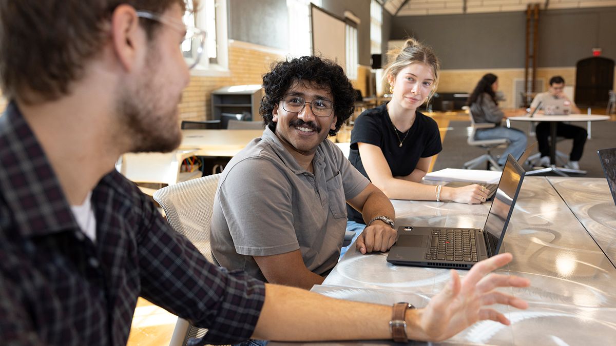 Three students collaborate in the BuildX space in Pomerene Hall.