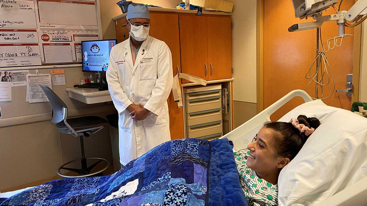 Doctor talks to Gigi Mokadam in their hospital bed
