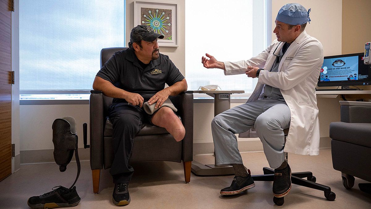 Doctor talking to a wounded veteran patient