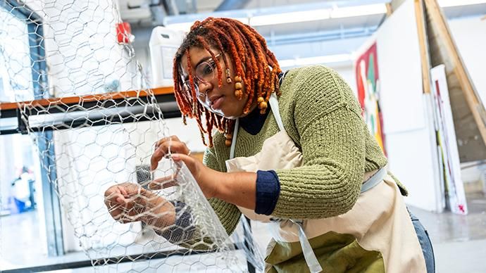Student creating art during studio art classes in the School of Art, College of Arts and Sciences