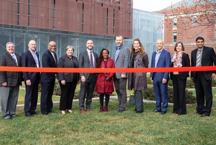 Leaders from DOE, Ohio State, Lawrence Berkley National Laboratory, AEP and ENGIE cut a commemorative ribbon in front of the East Regional Chilled Water Plant.