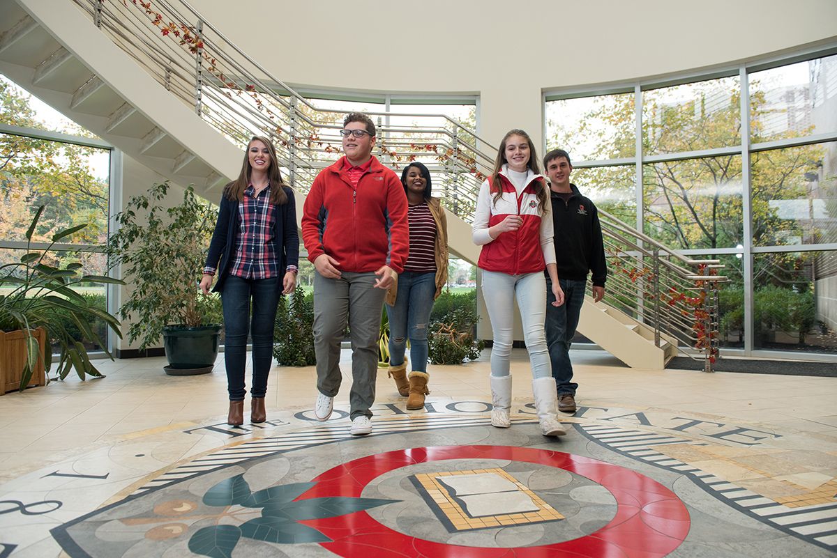 Five students standing together in a building on the Marion campus