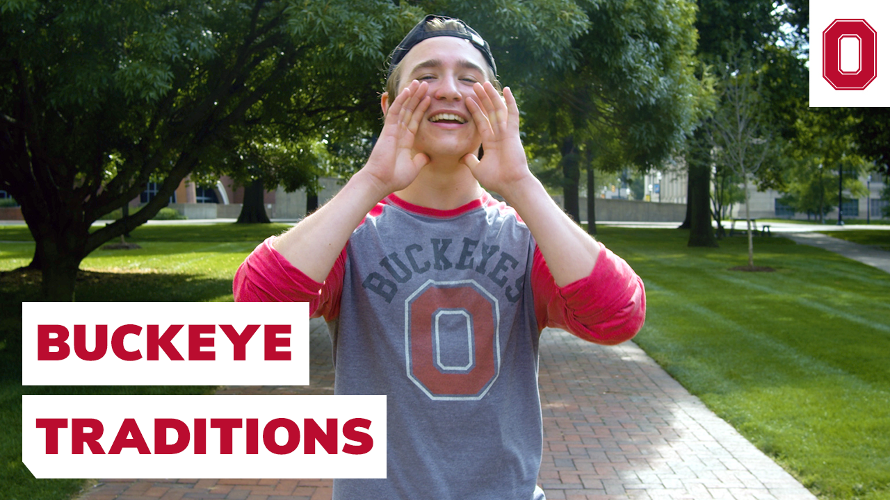 A student in a Buckeyes shirt is standing on the Oval with their hands cupped around their mouth. The text on the image says "Buckeye Traditions"