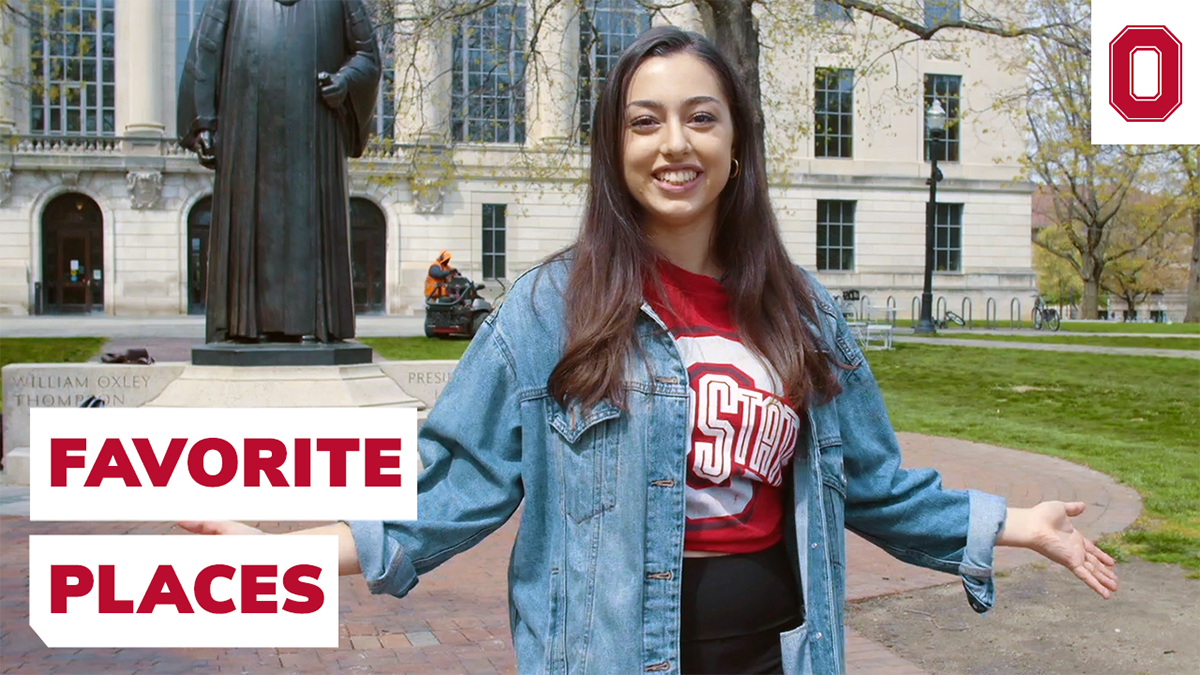 A student in a Ohio State shirt is standing in front of the Thompson statue on campus with their arms out. A text on the image reads 