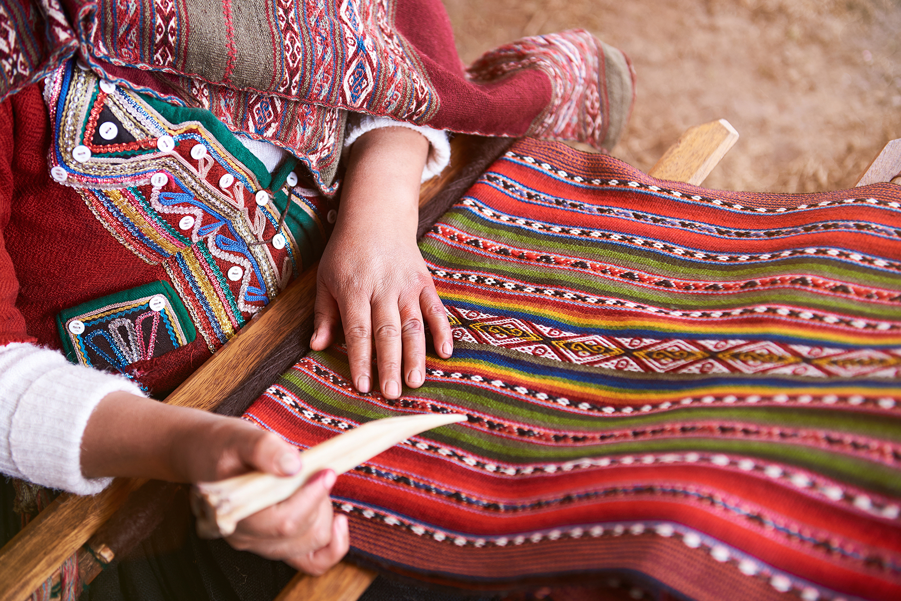 Peruvian woman making a blanket