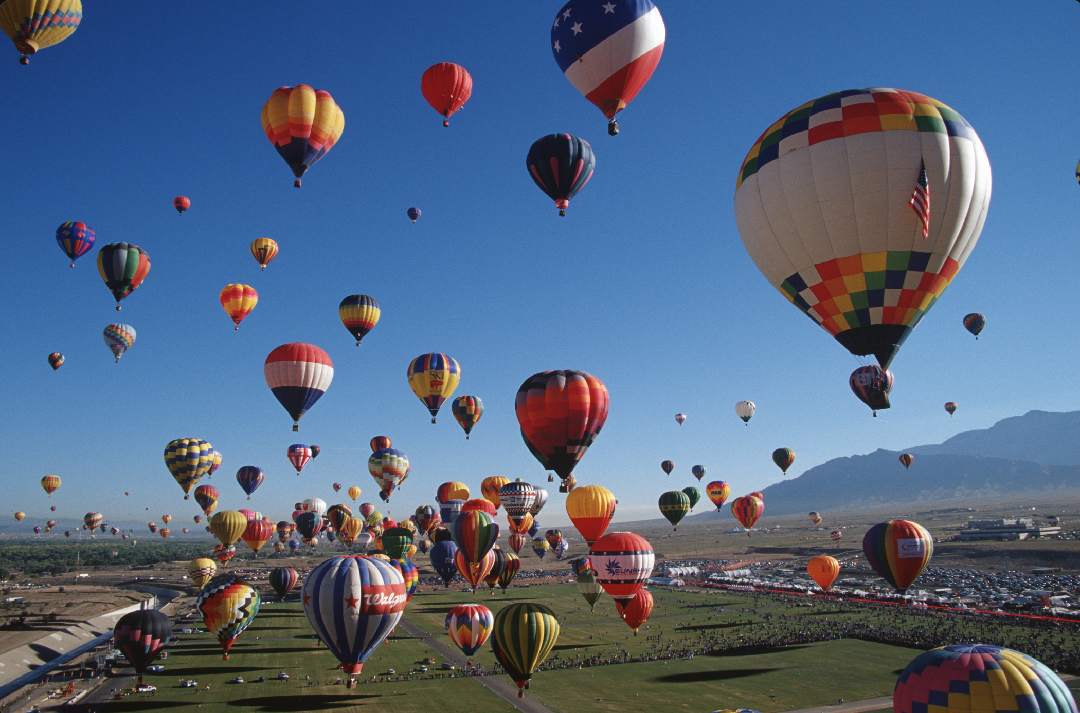 lots of hot air balloons take off