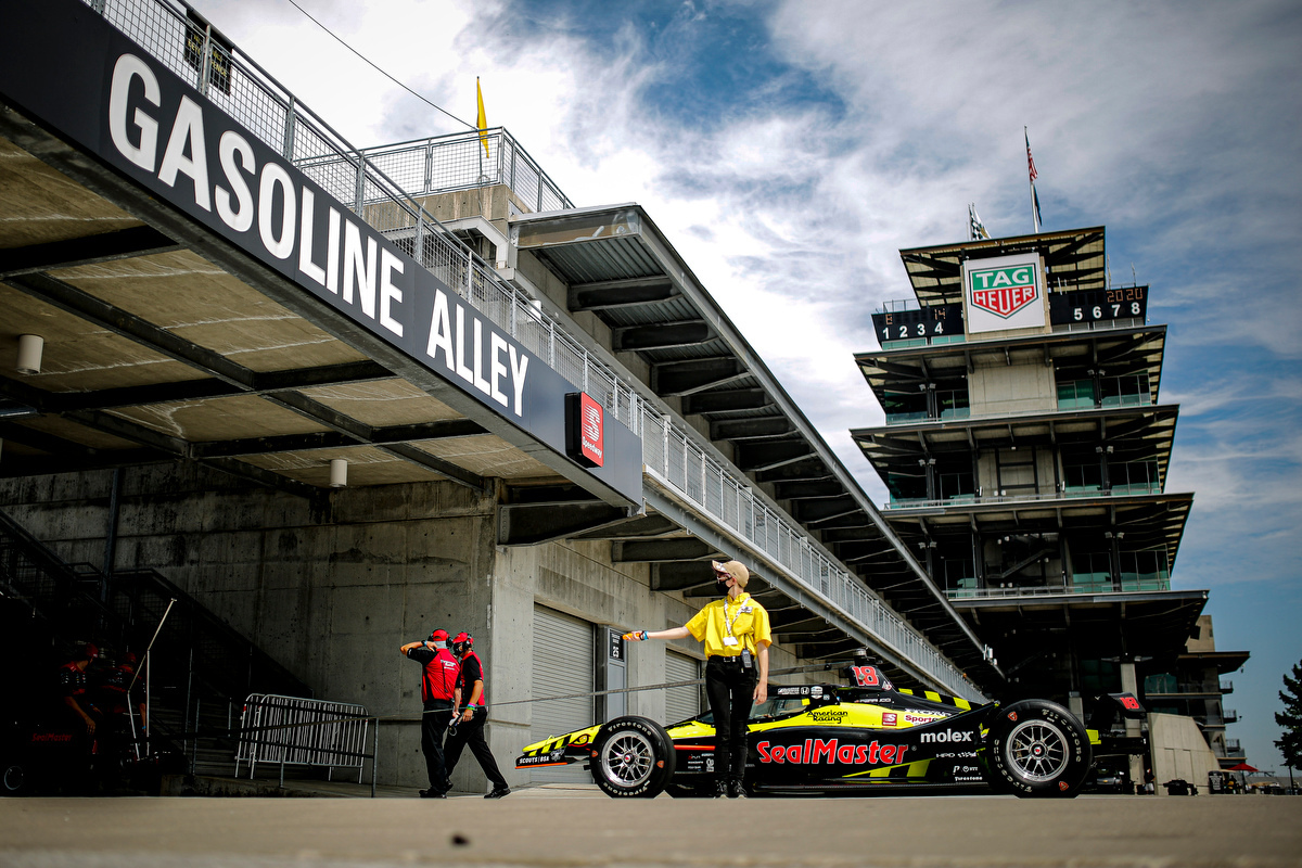 indy car pulling into garage