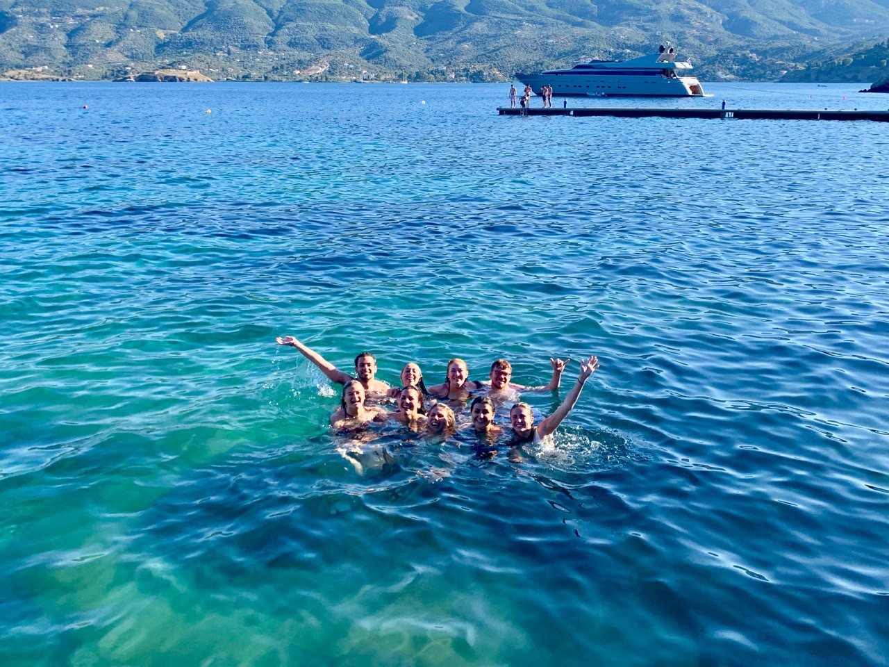 students swimming in Greece