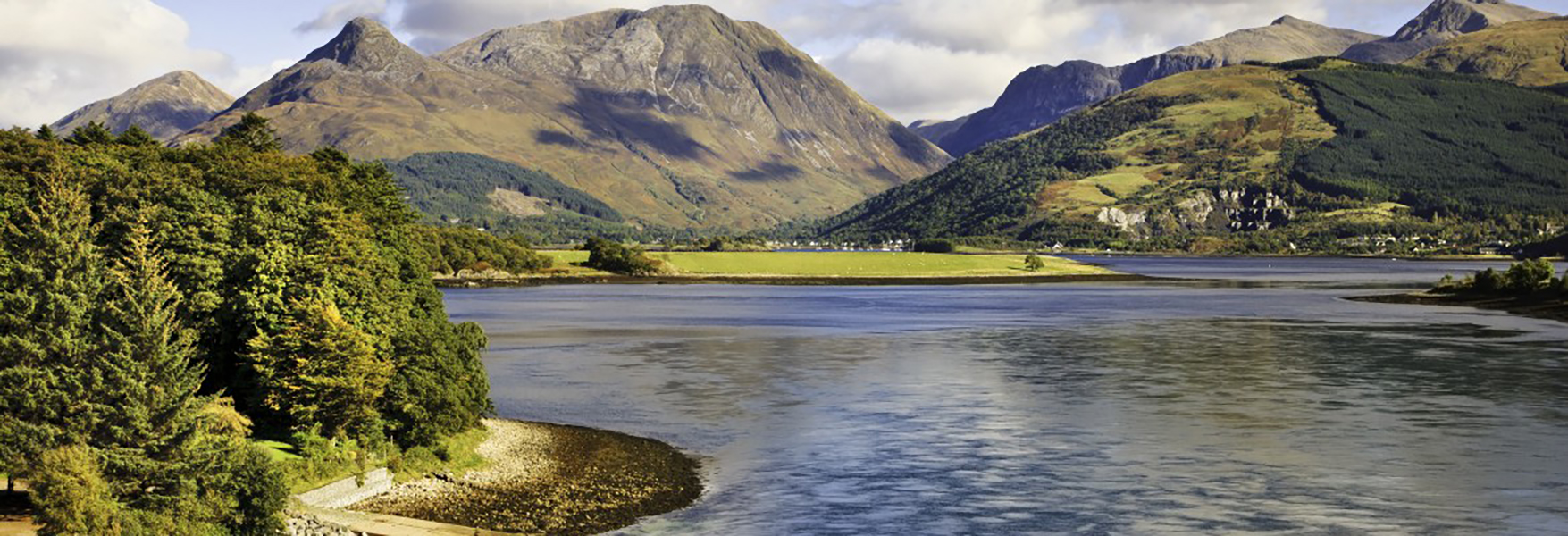 scotland countryside with mountains and large body of water