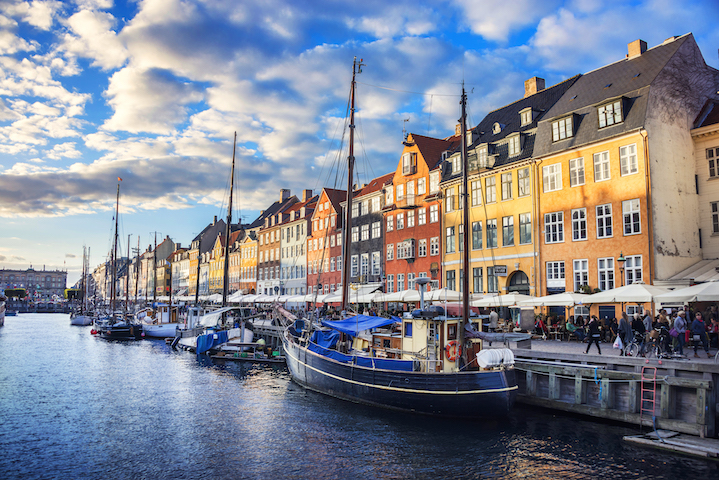 Small boats docked next to colorful buildings