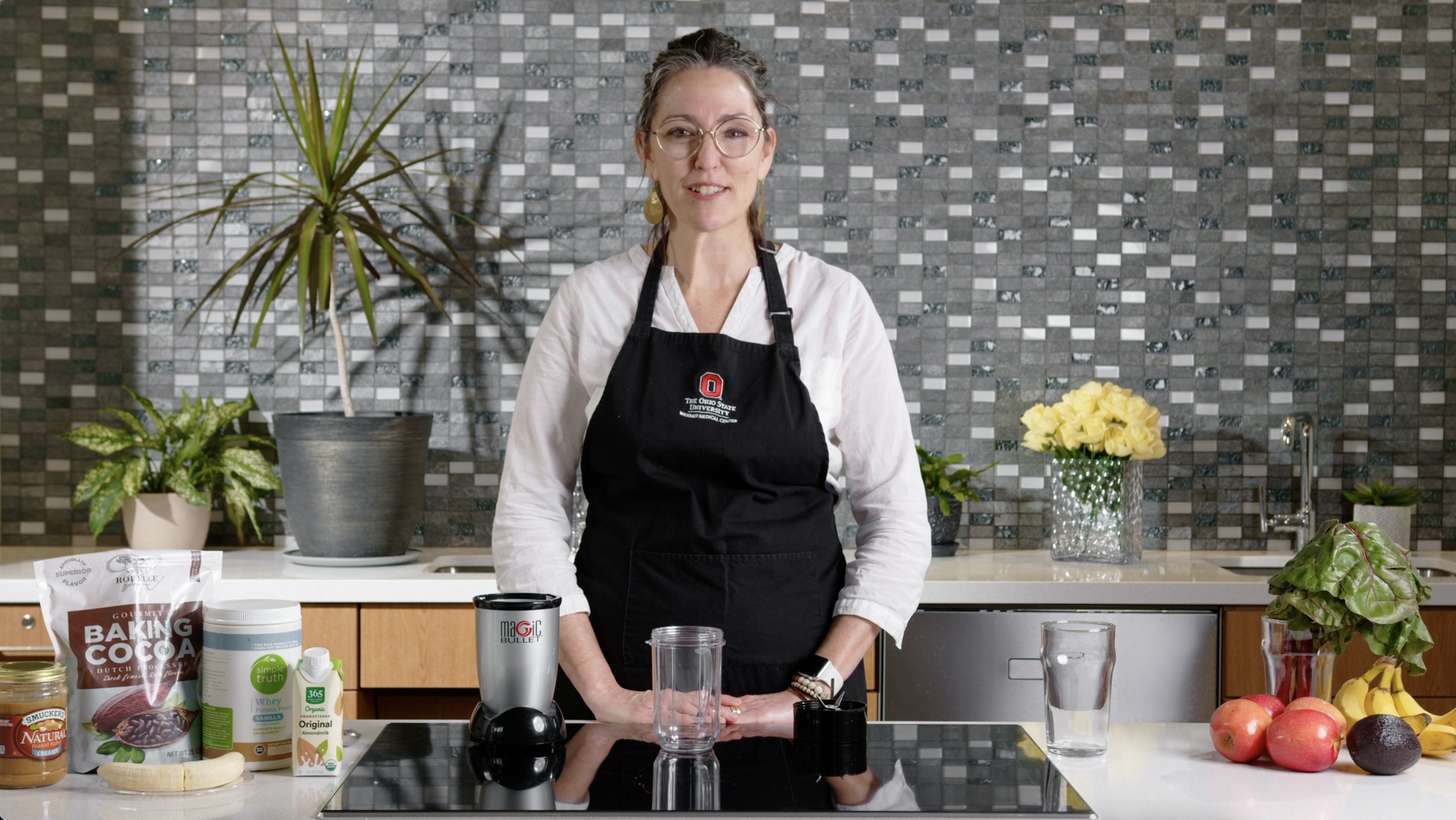 Jenny Shrodes stands at a counter