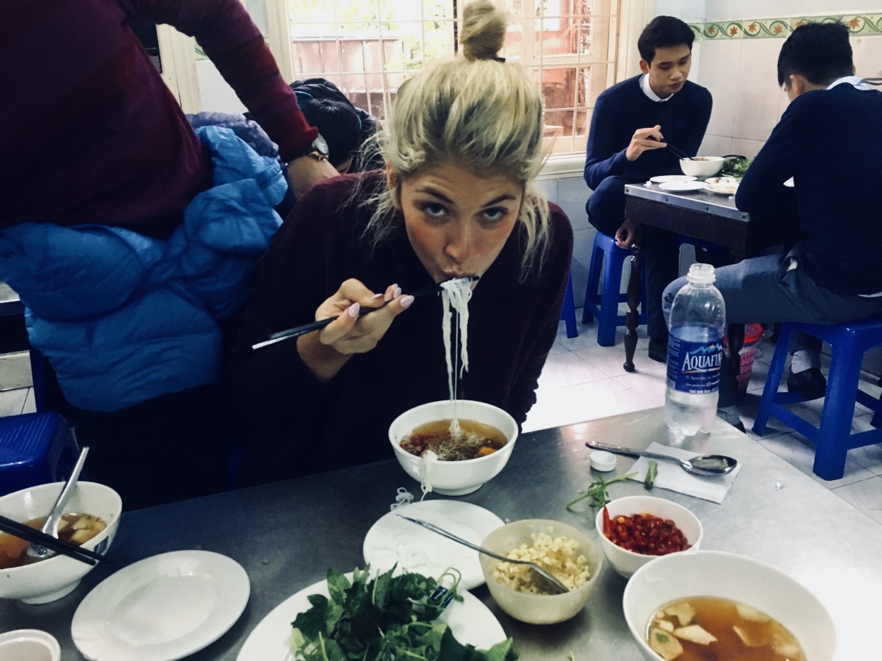 girl eating noodles