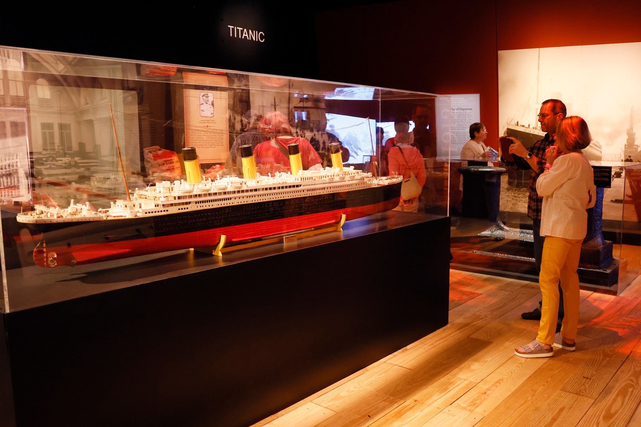 two people observe a model display of the Titanic