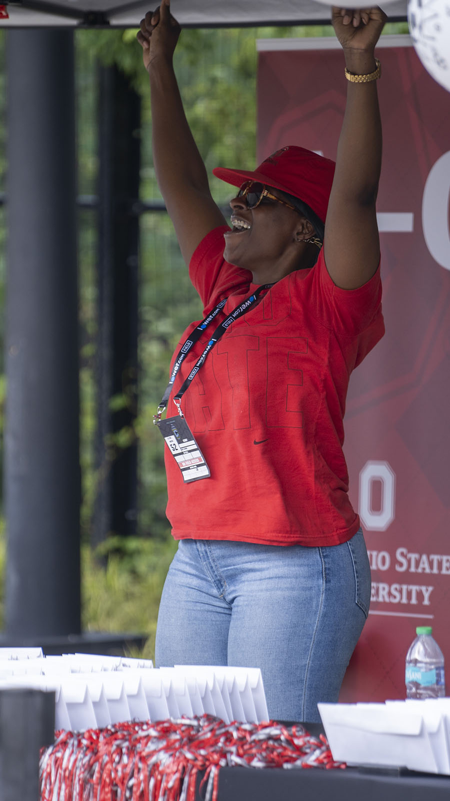 a person expressing joy with arms raised above their head