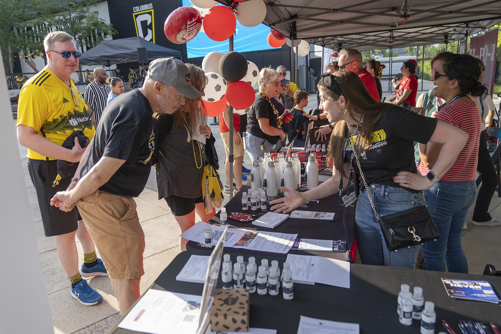 a person checking in at an event registration table