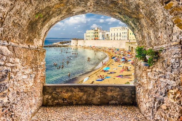 Photo of beach in Gallipoli seen through stone ruins
