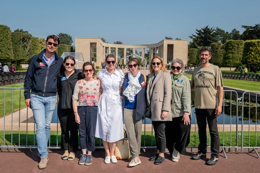 Tour participants in front of a large building