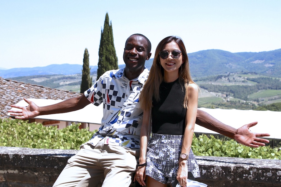 Two travelers in Florence with the vast countryside in the background