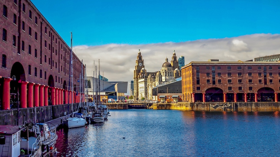 Large buildings nestled on the water in Liverpool