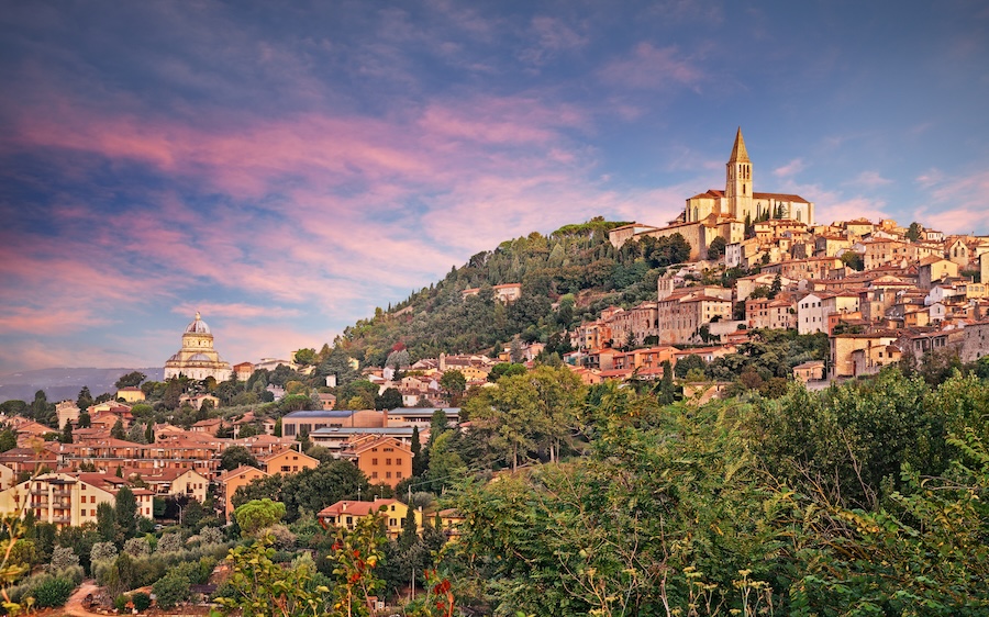 The city of Todi surround by lush green hills