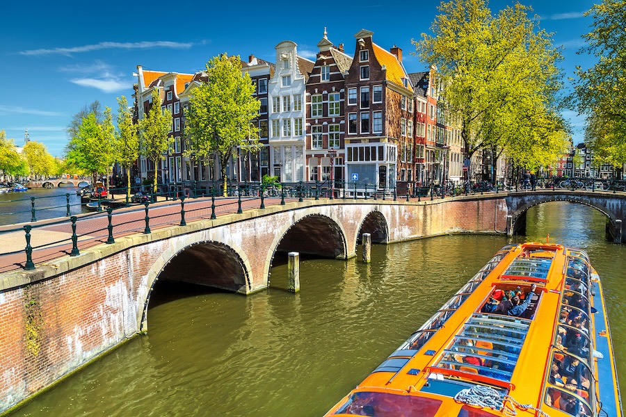 Amsterdam boat floating down a waterway