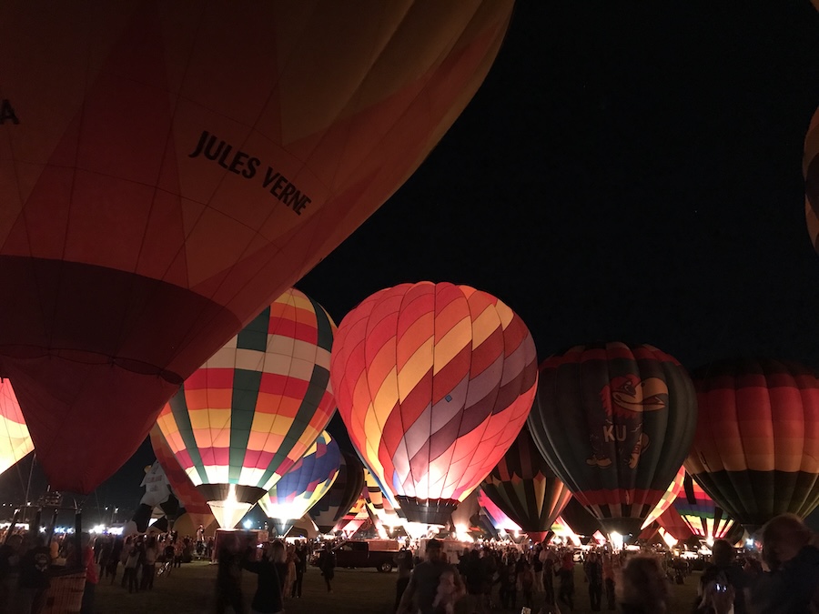 Hot air balloons glowing at night