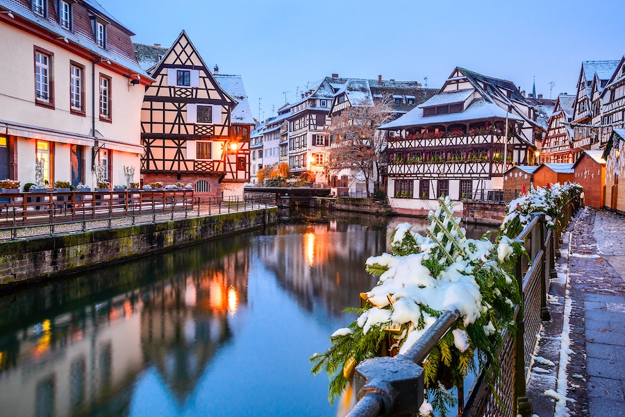 Strasbourg with snow covered greenery and buildings