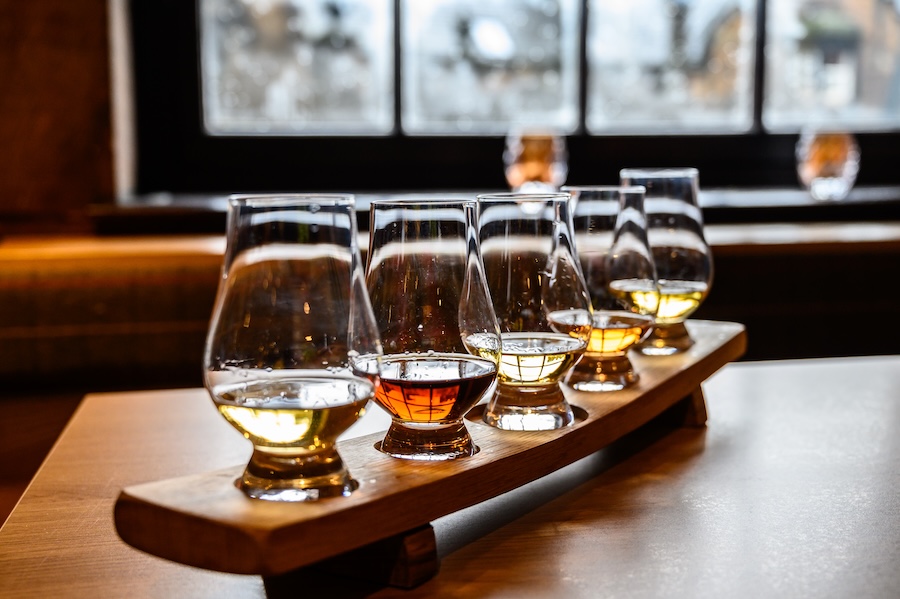 Whiskey glasses set up on a table for a tasting