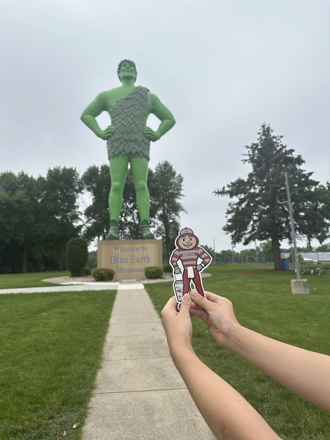 Brutus in front of a very large Jolly Green Giant statue in Blue Earth, Minnesota.