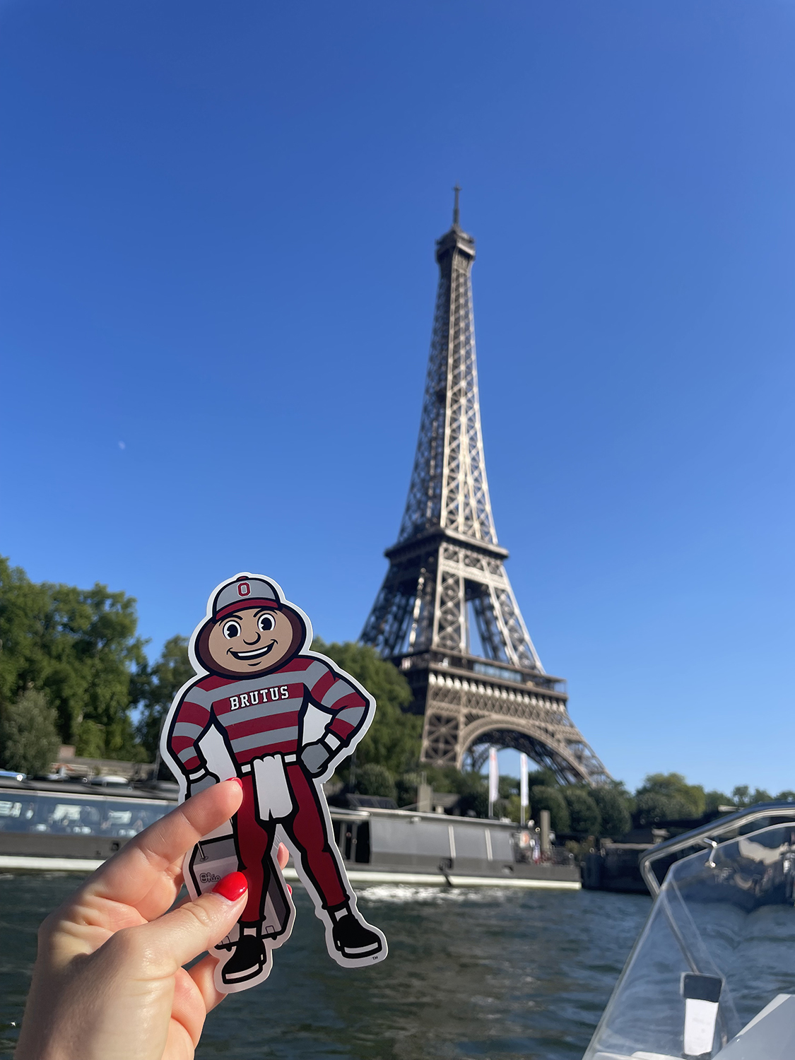 Brutus on a boat in front of the Eiffel Tower in Paris, France.