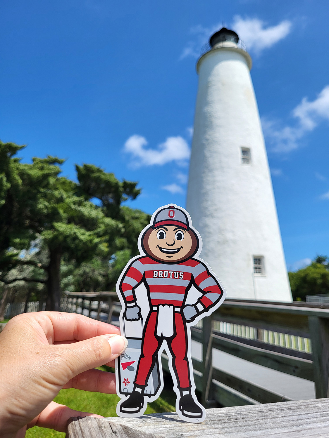 Brutus in front of a lighthouse in Outer Banks, North Carolina.