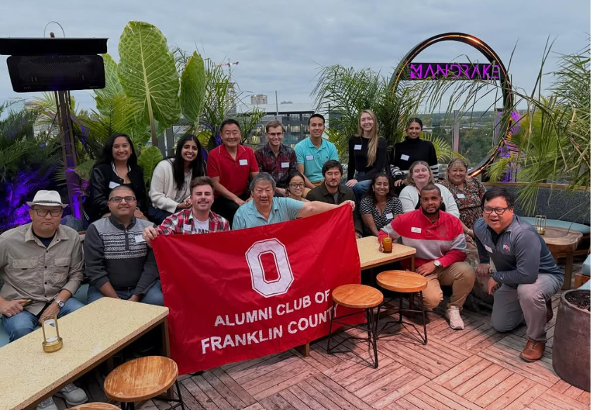 API society and franklin county club at a happy hour gathering and smiling