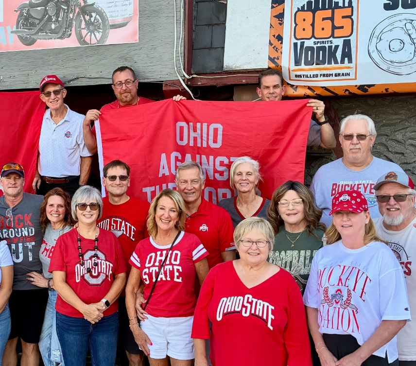 chattanooga club members at a game watch holding ohio against the world flag