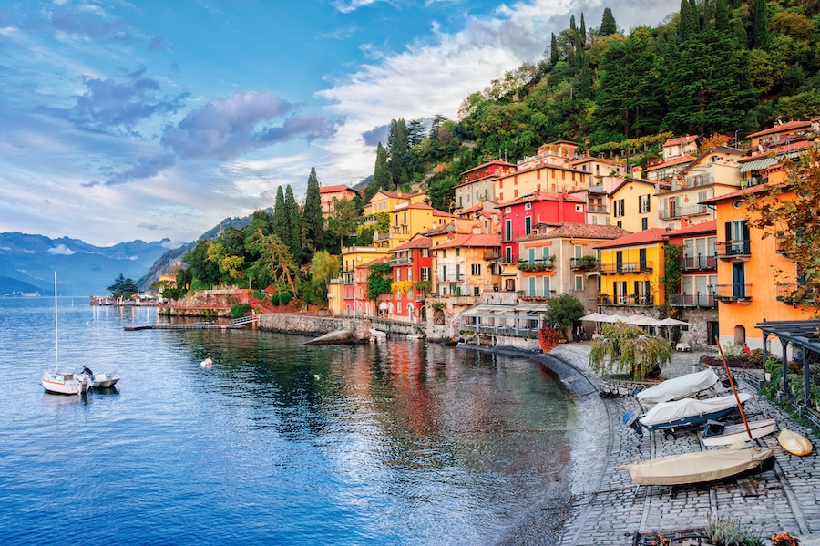 Colorful buildings, home and boats along the shoreline of Menaggio