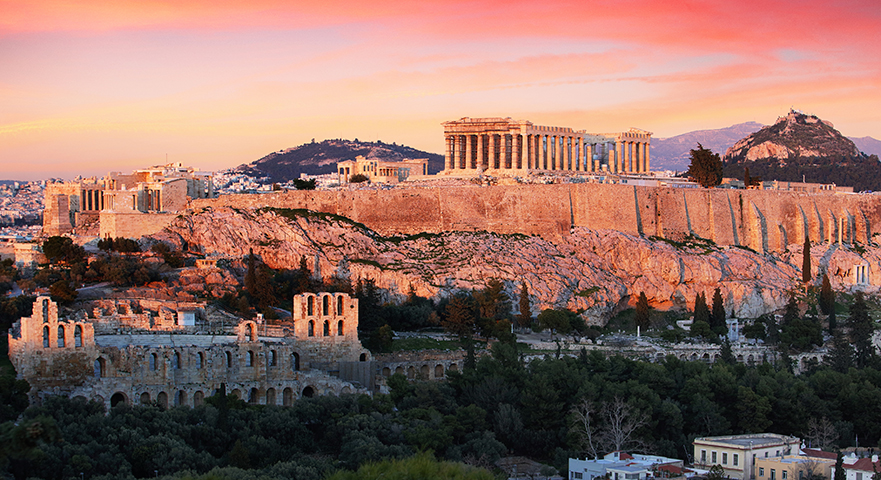 The Acropolis and Parthenon overlooking Athens at sunset.