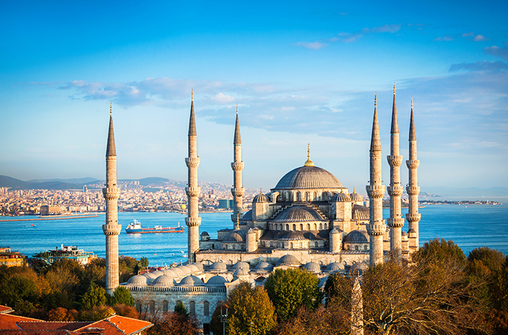 The Blue Mosque framed by minarets beside the Bosphorus in Istanbul.