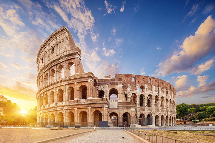 The Colosseum in Rome illuminated by early morning light.