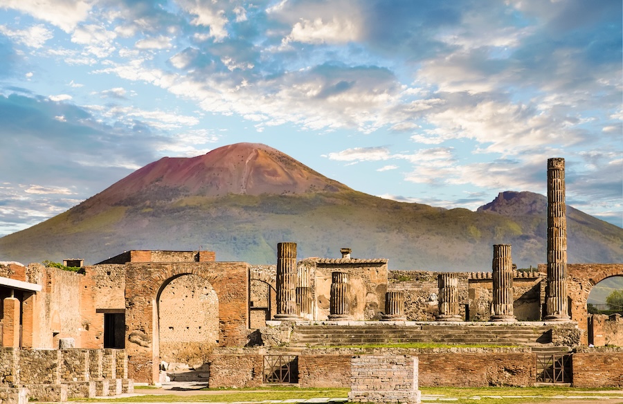 Mount Vesuvius towering over the ancient ruins of Pompeii, Italy, the historic site preserved after the volcanic eruption in 79 AD.
