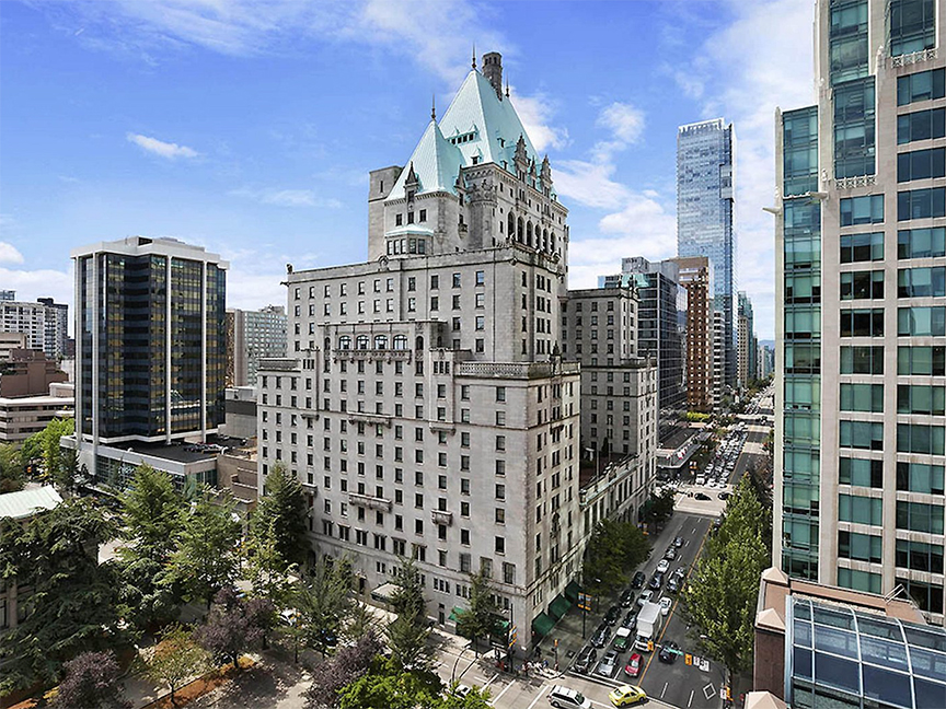 The iconic Hotel Vancouver rising above city streets in the heart of downtown Vancouver, British Columbia.