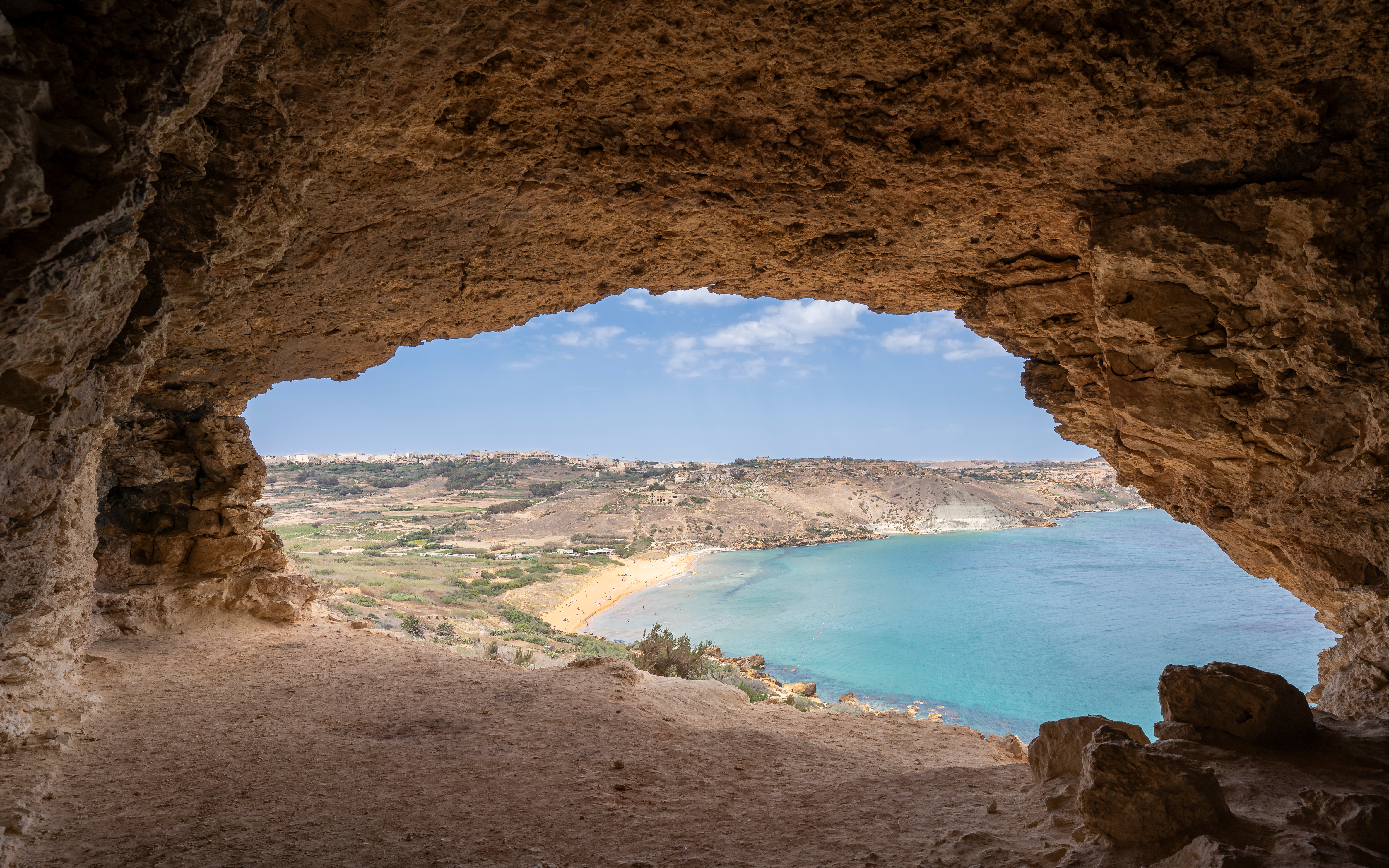 View from a coastal cave overlooking Ramla Bay on Gozo Island, Malta.