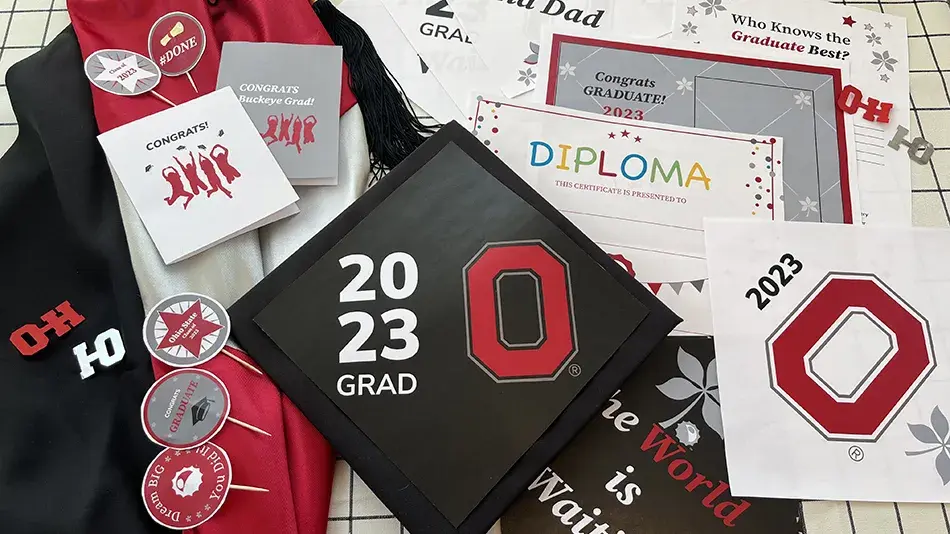 scarlet and gray graduation-themed items including stationary and cap designs