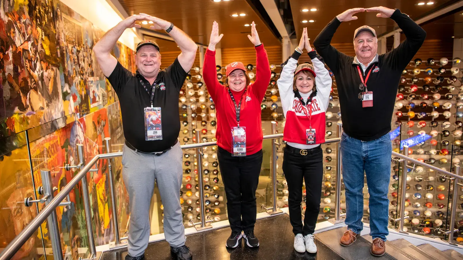 four people pose for o-h-i-o photo