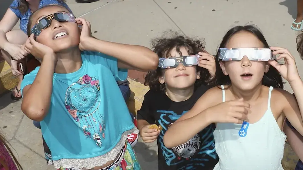 elementary students wearing eclipse glasses