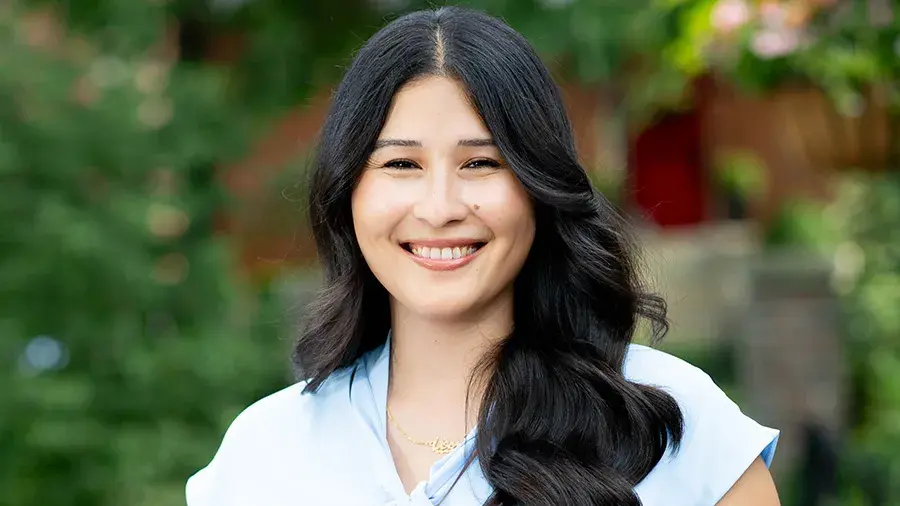 smiling woman wearing a blue shirt