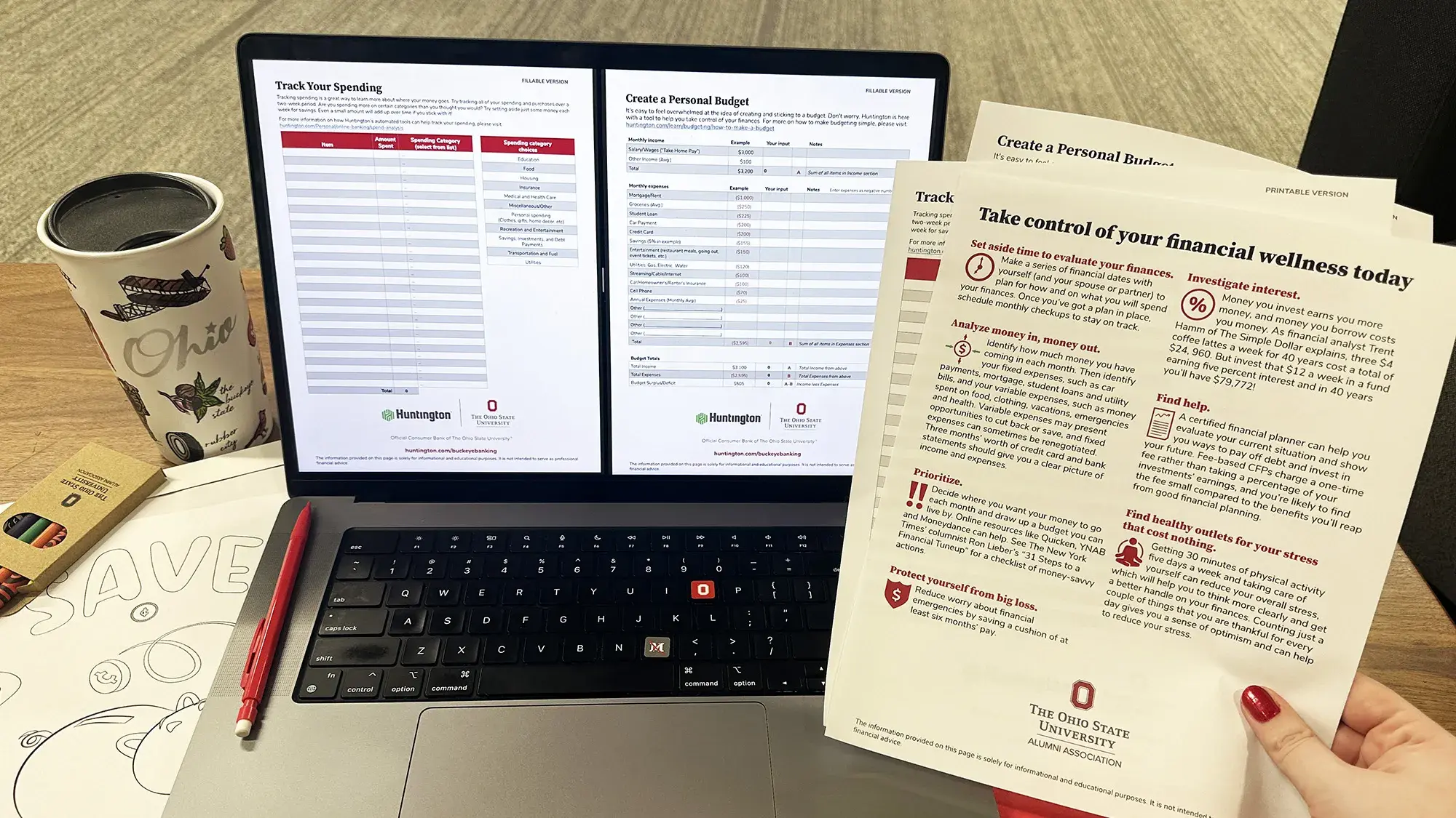 open laptop with financial literacy documents displayed on the screen